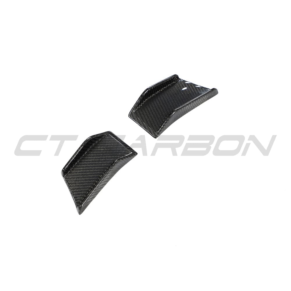 BMW 4 Series G22 G23 carbon fiber canards by CT Carbon, close-up view of aerodynamic car accessories on the front bumper.