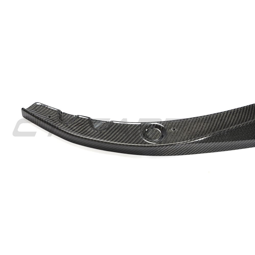 BMW G22 4 Series carbon fibre kit by CT Carbon, featuring splitter and MP-style components on a sleek sports car.
