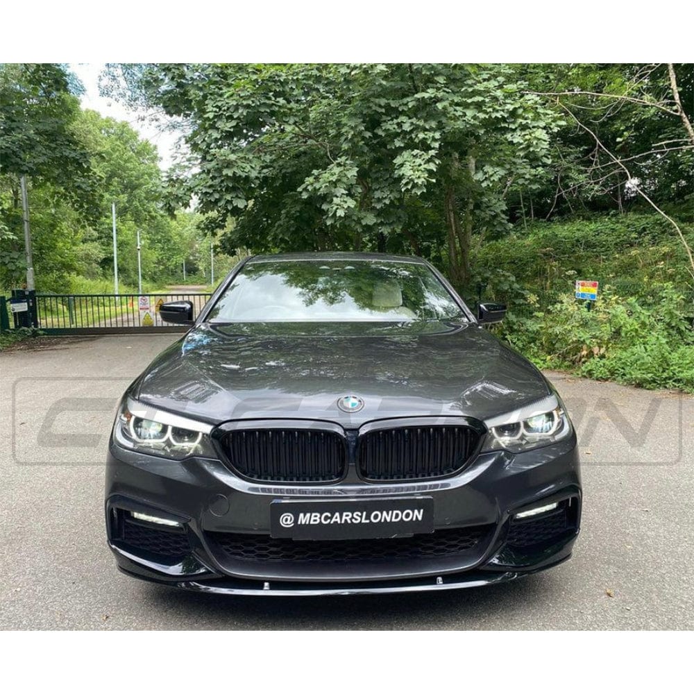 BMW 5 Series G30 gloss black full kit by CT Carbon, M5 style exterior upgrade, shown on vehicle in natural lighting.