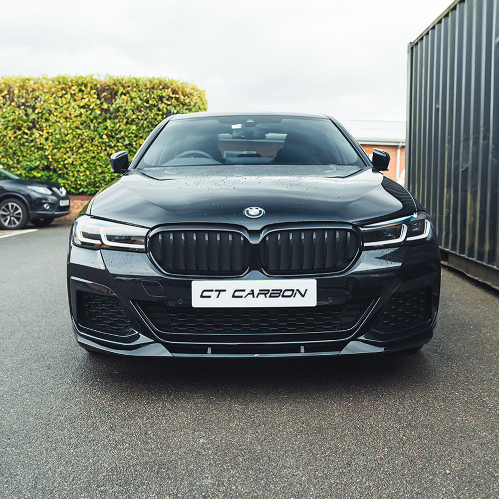 BMW 5 Series G30 LCI 2021+ CT Carbon gloss black kit installed on vehicle, showcasing sleek, matte black accents and V4 style details.