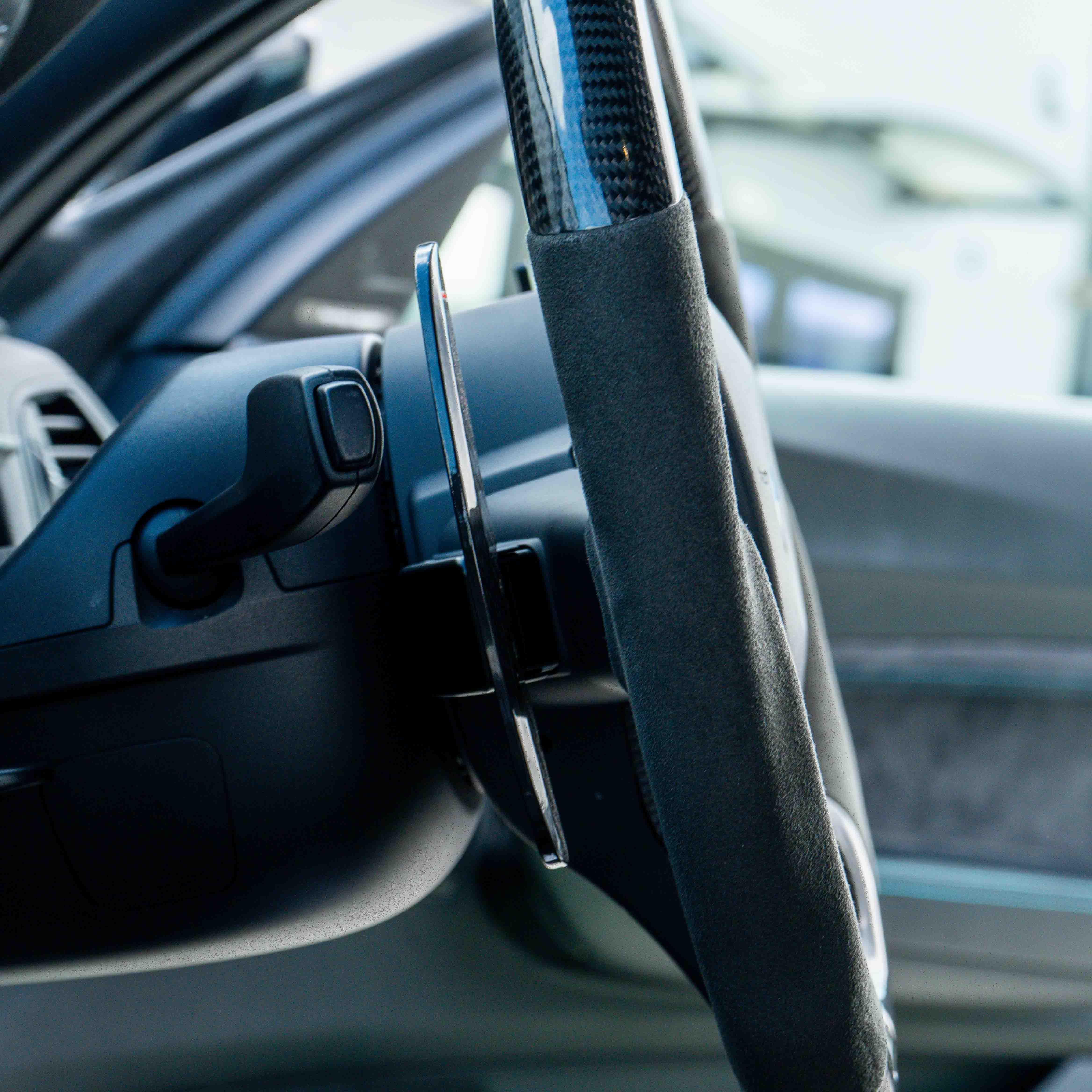 BMW carbon fiber magnetic shifter paddles by CT Carbon, sleek racing-style accessories for sporty driving.