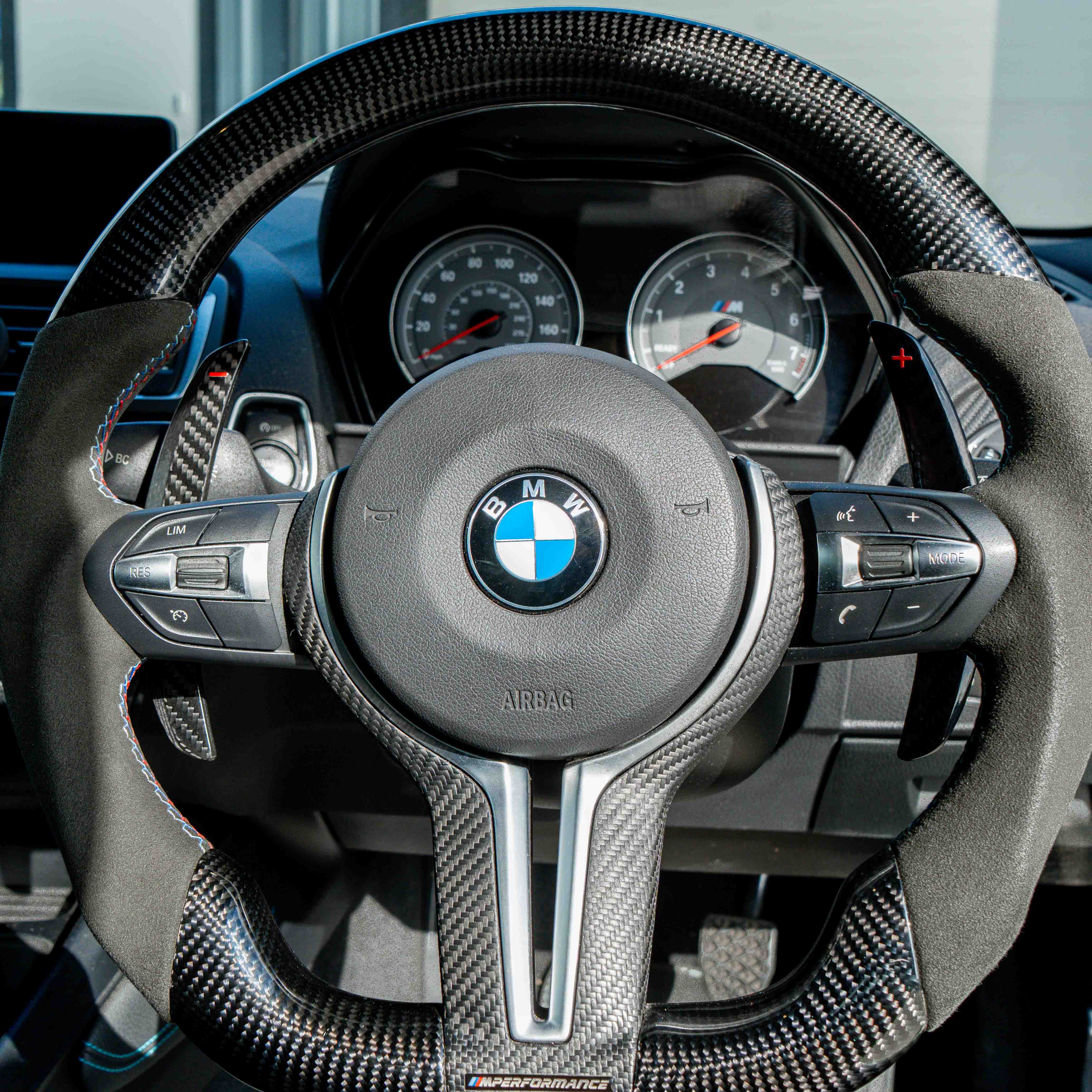 BMW carbon fiber magnetic shifter paddles by CT Carbon, sleek and lightweight car accessories for sporty steering control.