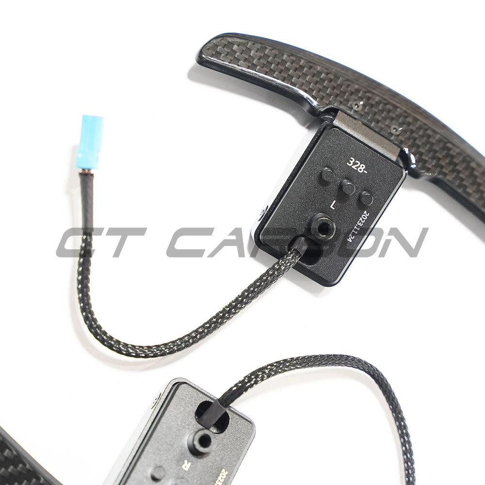 BMW carbon fiber magnetic shifter paddles by CT Carbon, sleek and lightweight accessory for enhanced driving control and style.