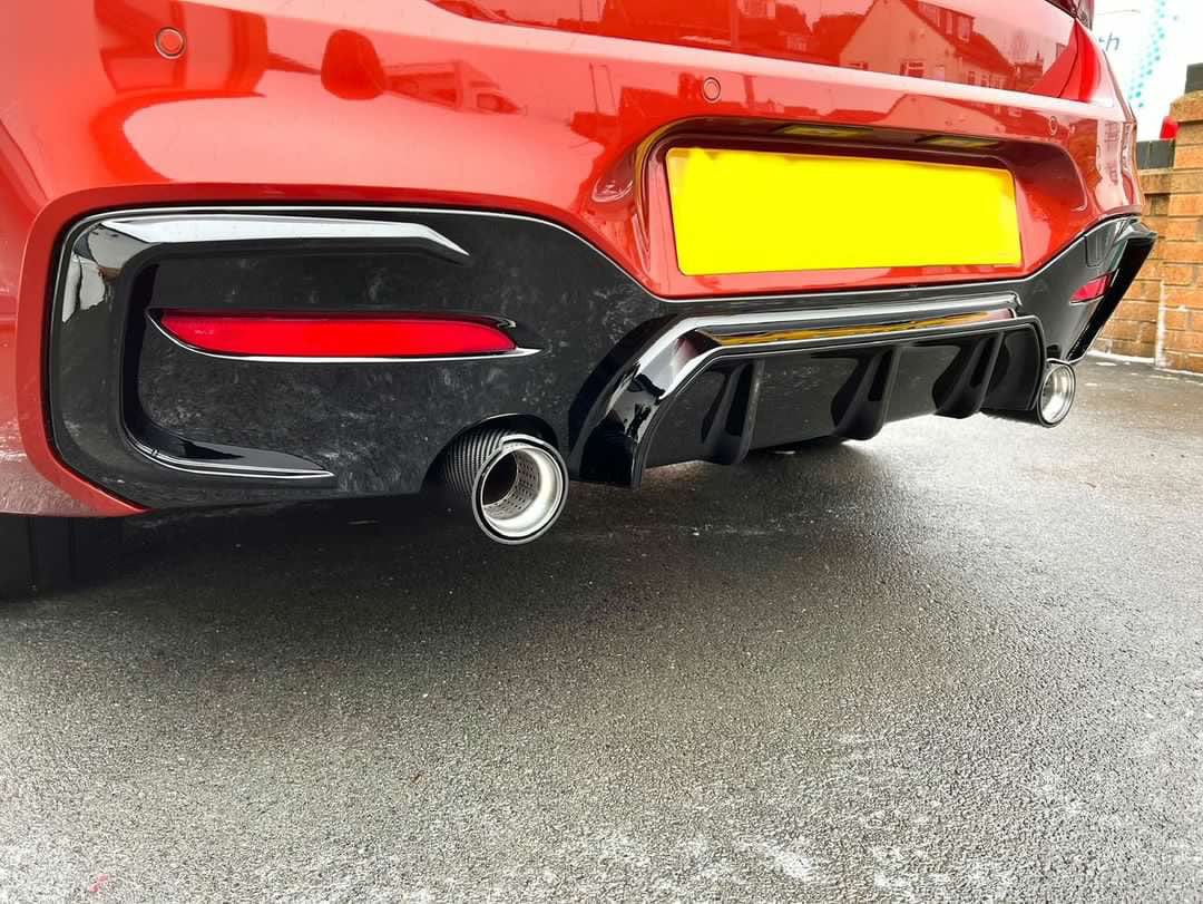 BMW F20 F21 1 Series LCI CT Carbon gloss black diffuser for sporty rear styling, shown installed on the vehicle.