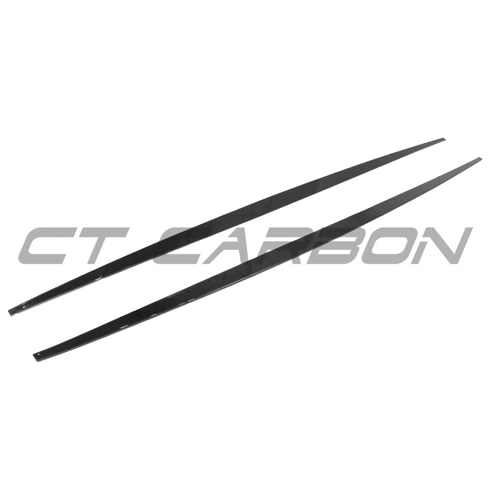 BMW F20 F21 1 Series LCI gloss black side skirts by CT Carbon installed on side of vehicle, showcasing sleek, aerodynamic design.