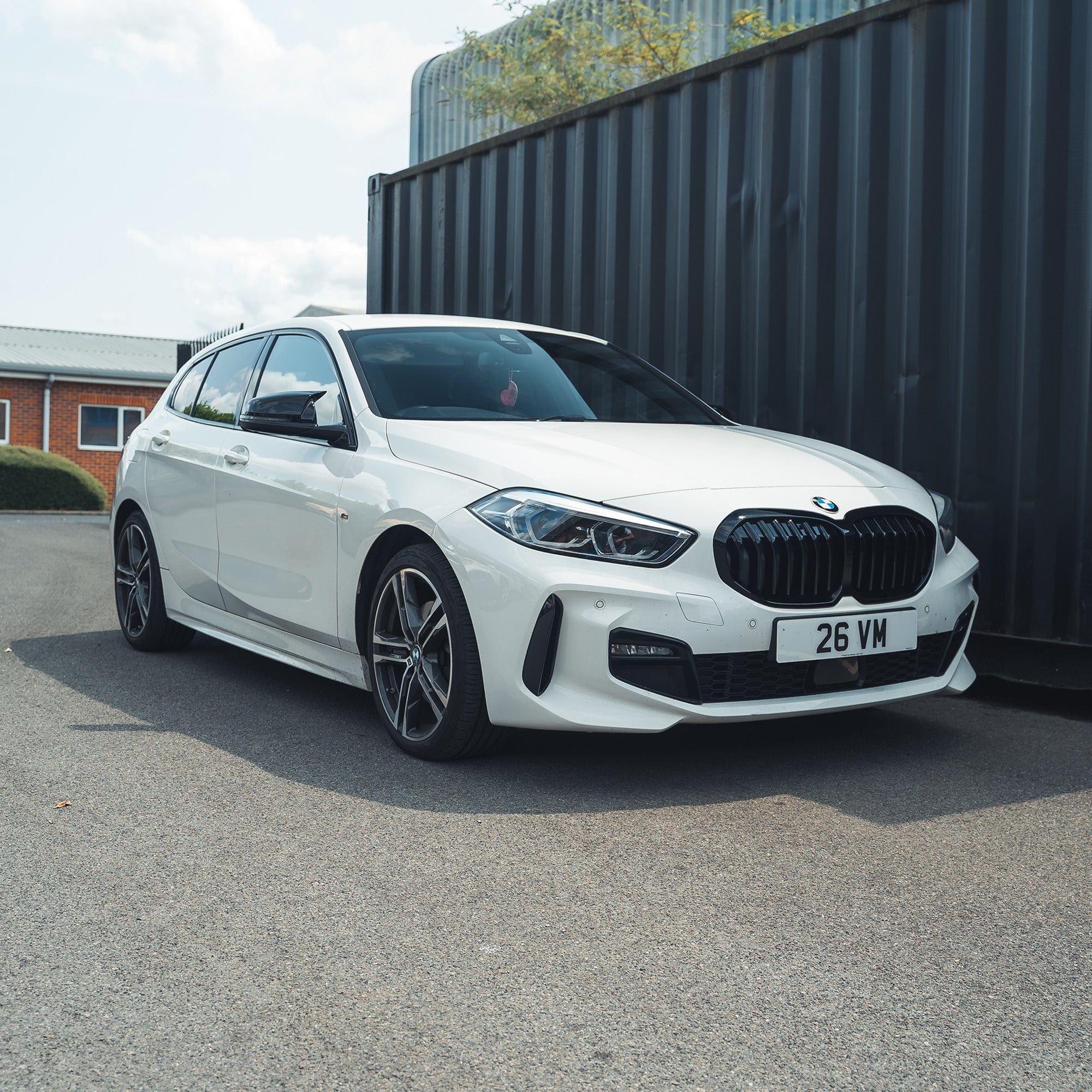 BMW F40 1 Series gloss black single slat grille by CT Carbon, showcasing the sleek, matte black grille design on the vehicle front.