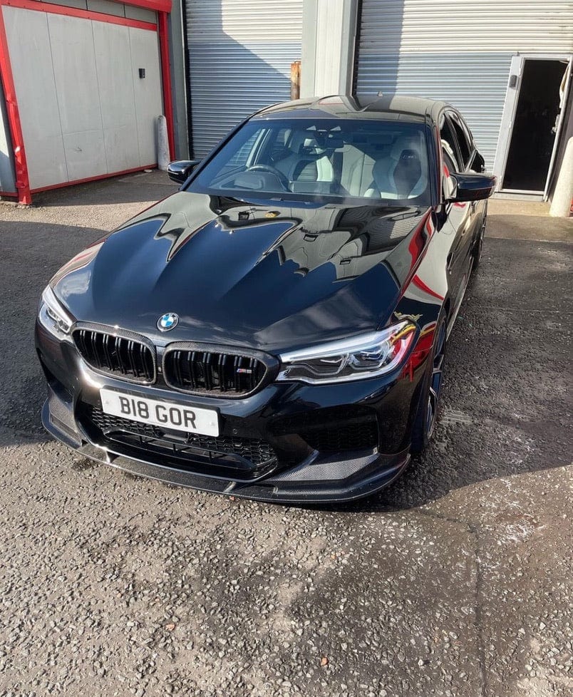 BMW F90 M5 saloon with CT Carbon full carbon fiber kit, featuring 3D-style carbon fiber components on the car's exterior.