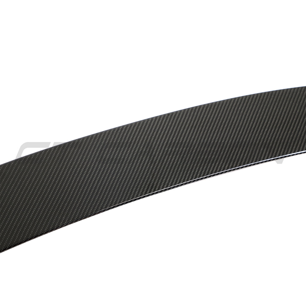BMW F96 X6M and G06 X6 carbon fiber boot spoiler by CT Design, showcasing sleek aerodynamic design on a black car.