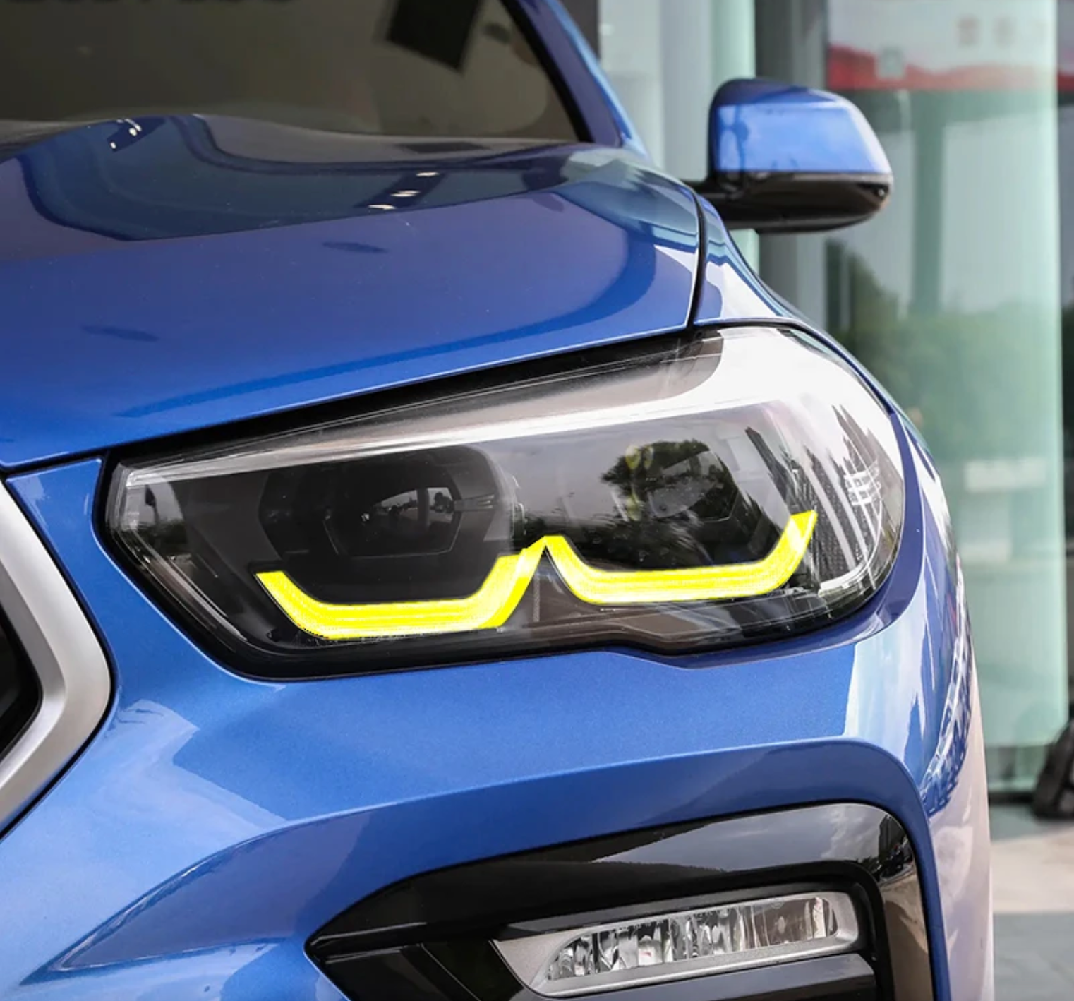 BMW F95 X5M yellow adaptive DRL module set by CT Carbon, showing two bright yellow LED daytime running light modules.