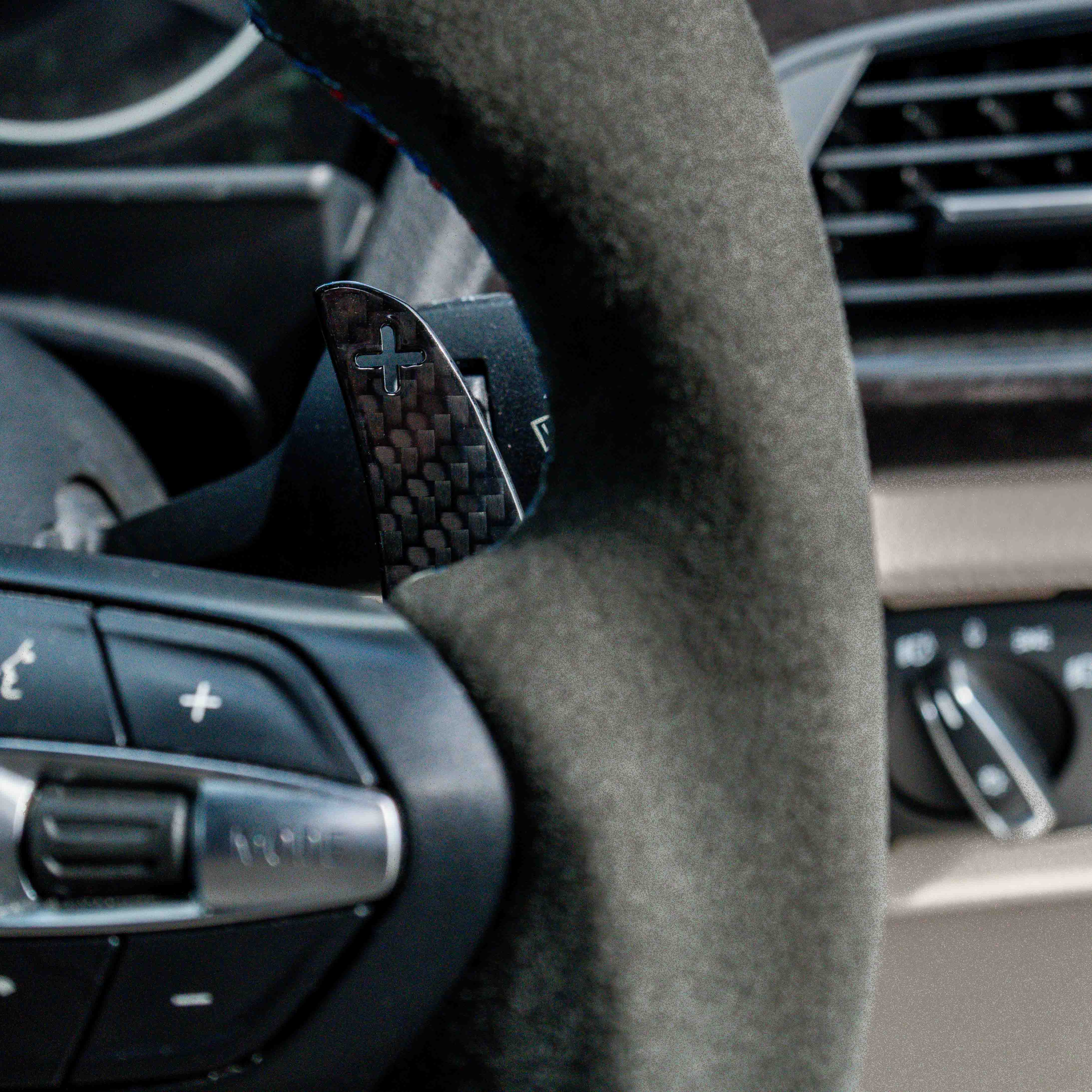 BMW Fxx carbon fibre magnetic shifter paddles by CT Carbon, sleek and lightweight automotive accessories for enhanced driving style.