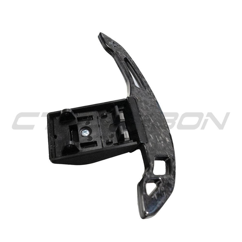 BMW Fxx forged carbon fiber shifter paddles V3 by CT Carbon, close-up view showing sleek carbon fiber design and paddle details.