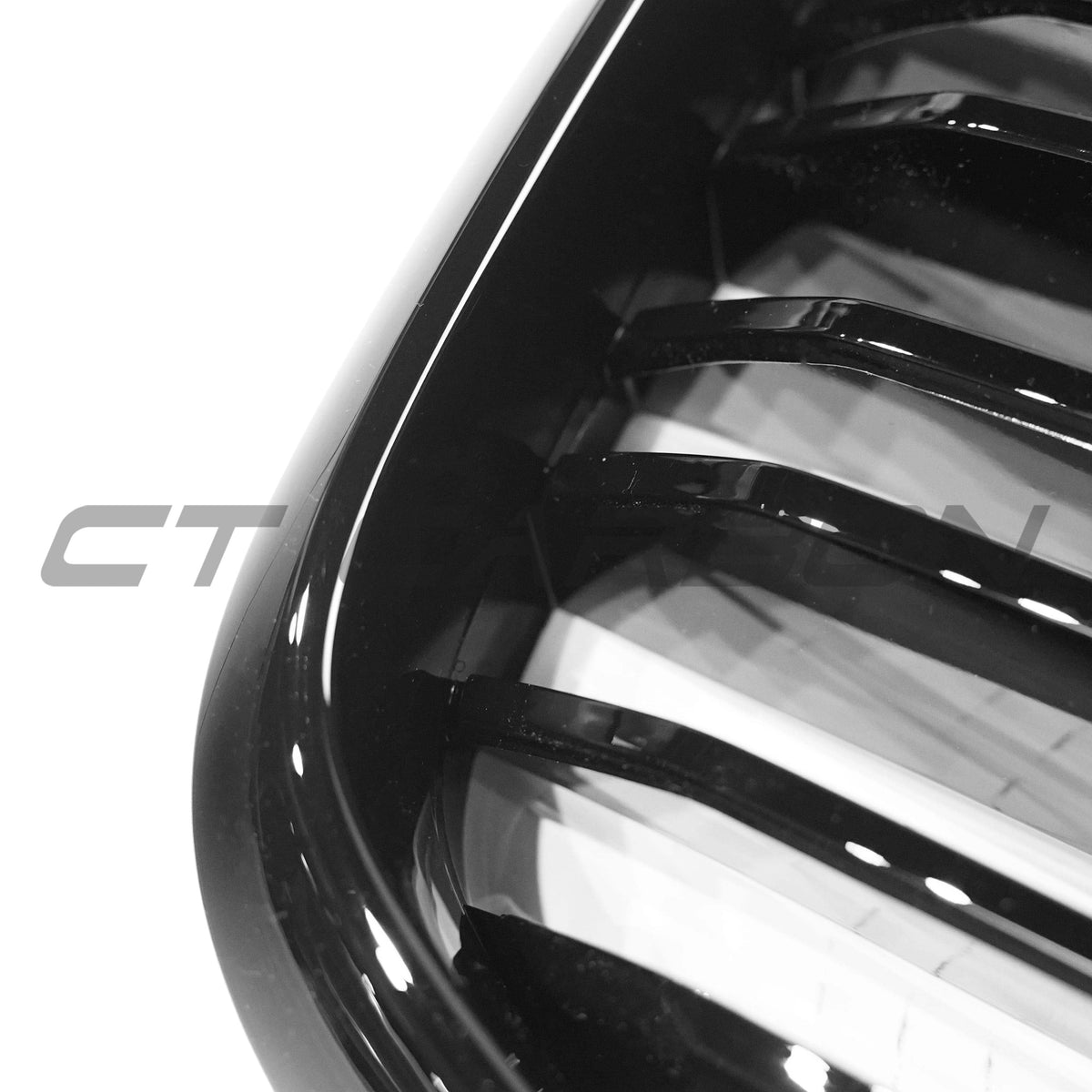BMW G02 X4 and G01 X3 LCI 2021+ double slat black grille by CT Carbon, showcasing sleek black design on vehicle front.