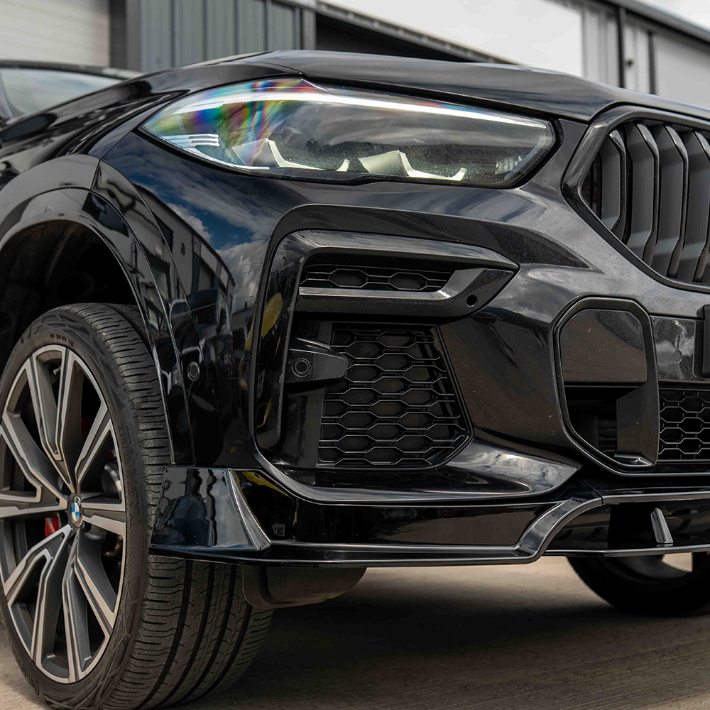 BMW G06 X6 Pre-LCI full gloss black kit by CT Carbon, including custom-fit parts for a sleek, finished look.
