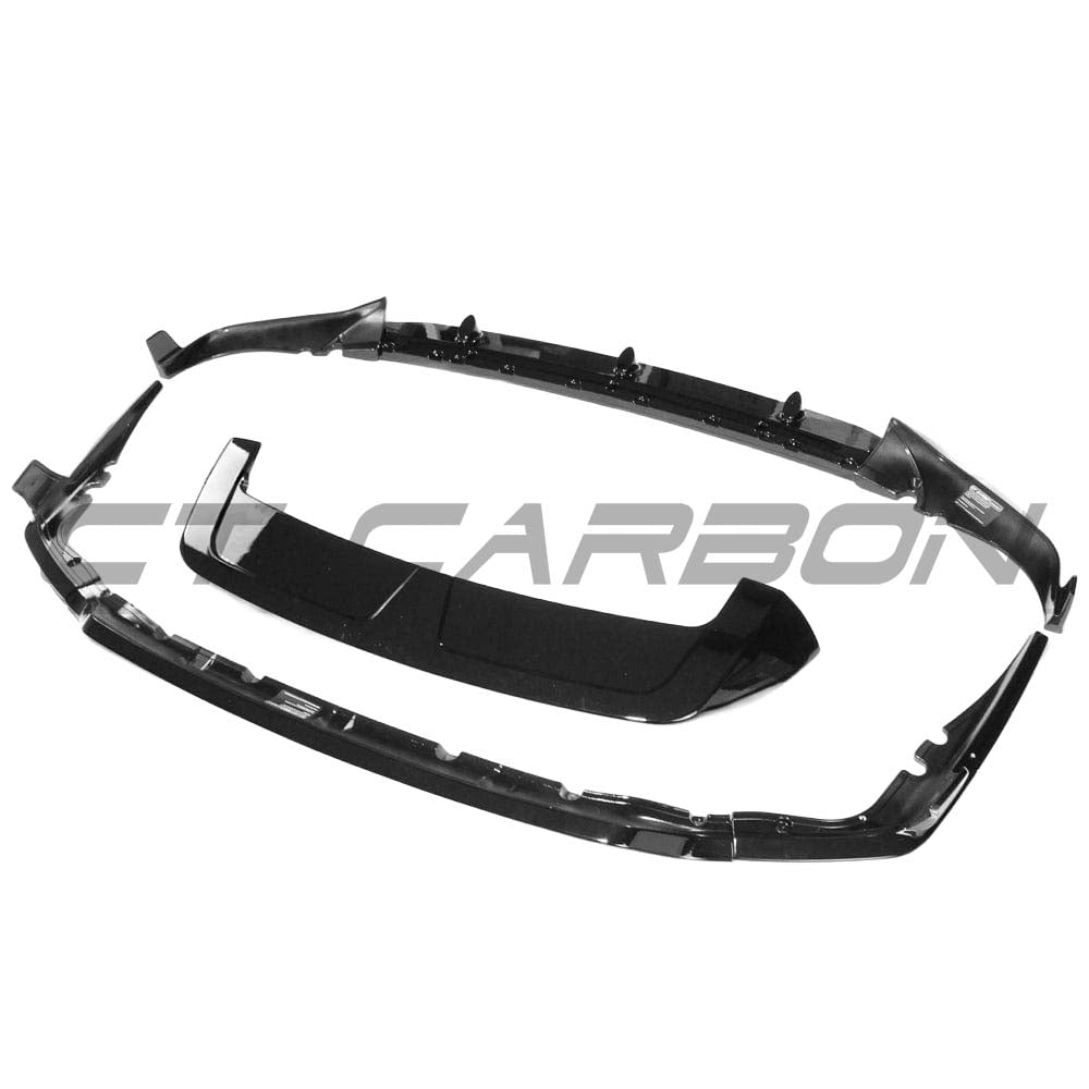 BMW G07 X7 2018-2022 CT Carbon full gloss black kit, including front and rear trim pieces, displayed on the vehicle.