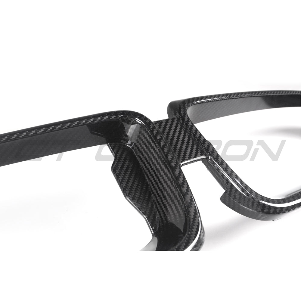 BMW G42 2 Series carbon fiber grille by CT Carbon, close-up of sleek black automotive grille with textured carbon fiber finish.