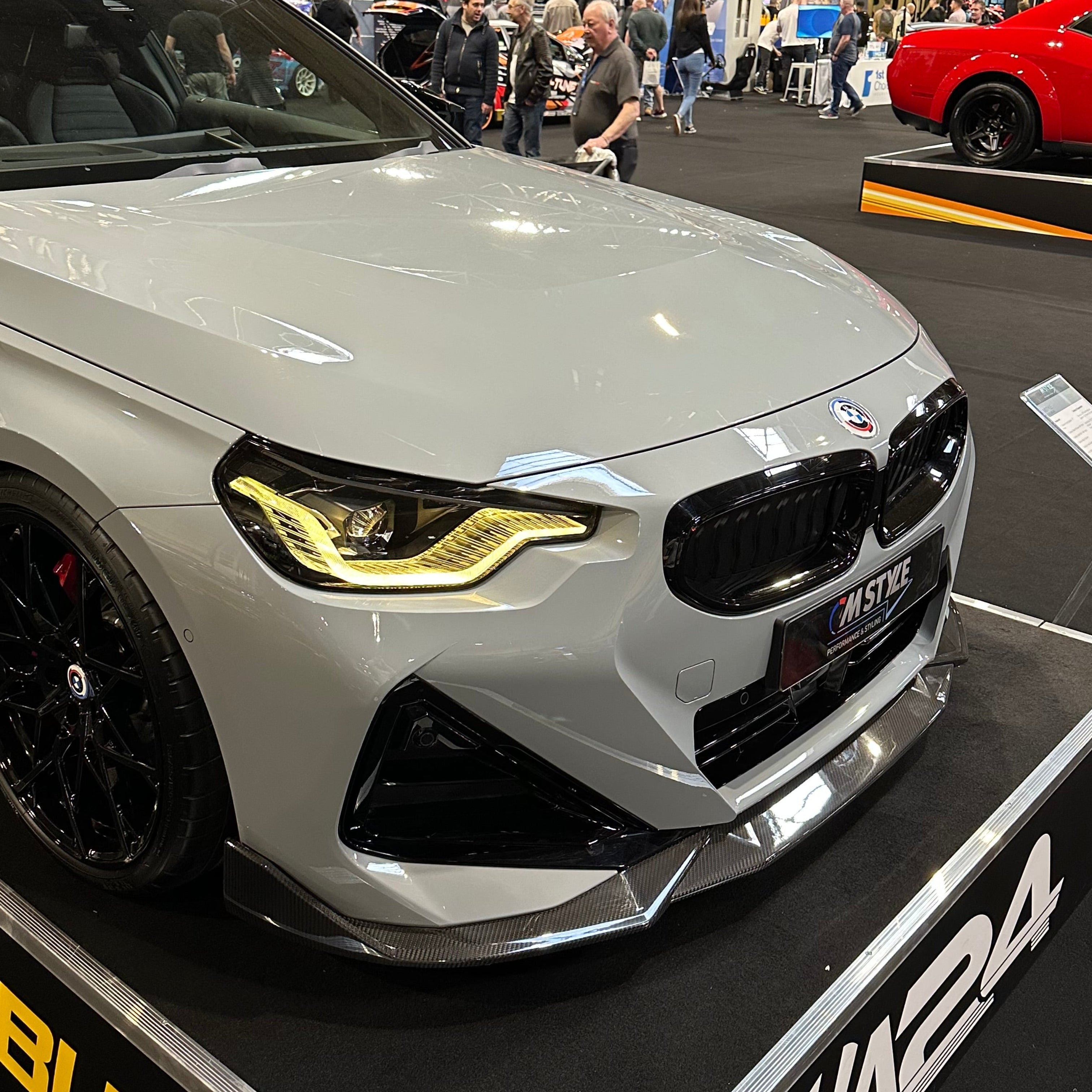 BMW G42 2 Series carbon fibre splitter by CT Design, showing sleek black carbon texture and aerodynamic design on the front of the car.