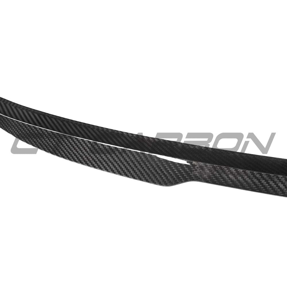BMW G42 2 Series M2 carbon fiber spoiler by CT Carbon, V2 style, shown mounted on the sporty rear of the vehicle.