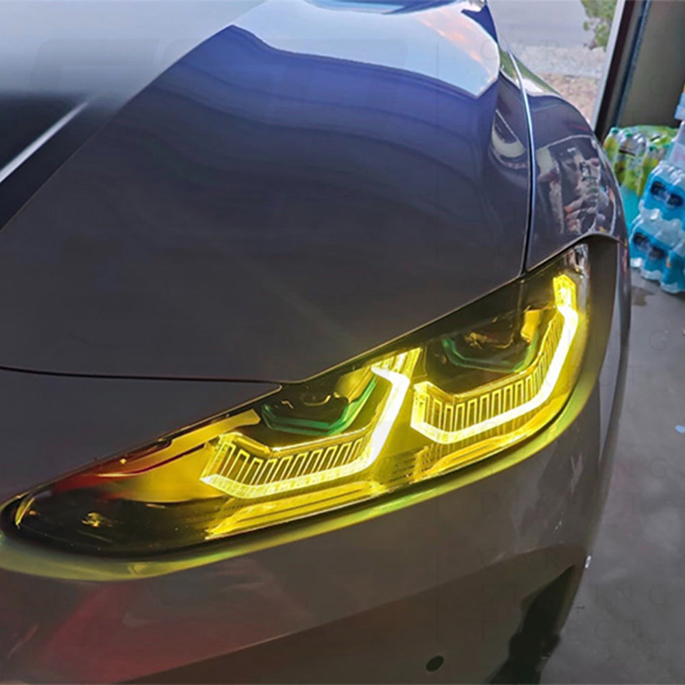 BMW G80 G81 G82 G83 M3 M4 CT Carbon yellow adaptive DRL module set visible on headlights, designed for 2021-2025 models.