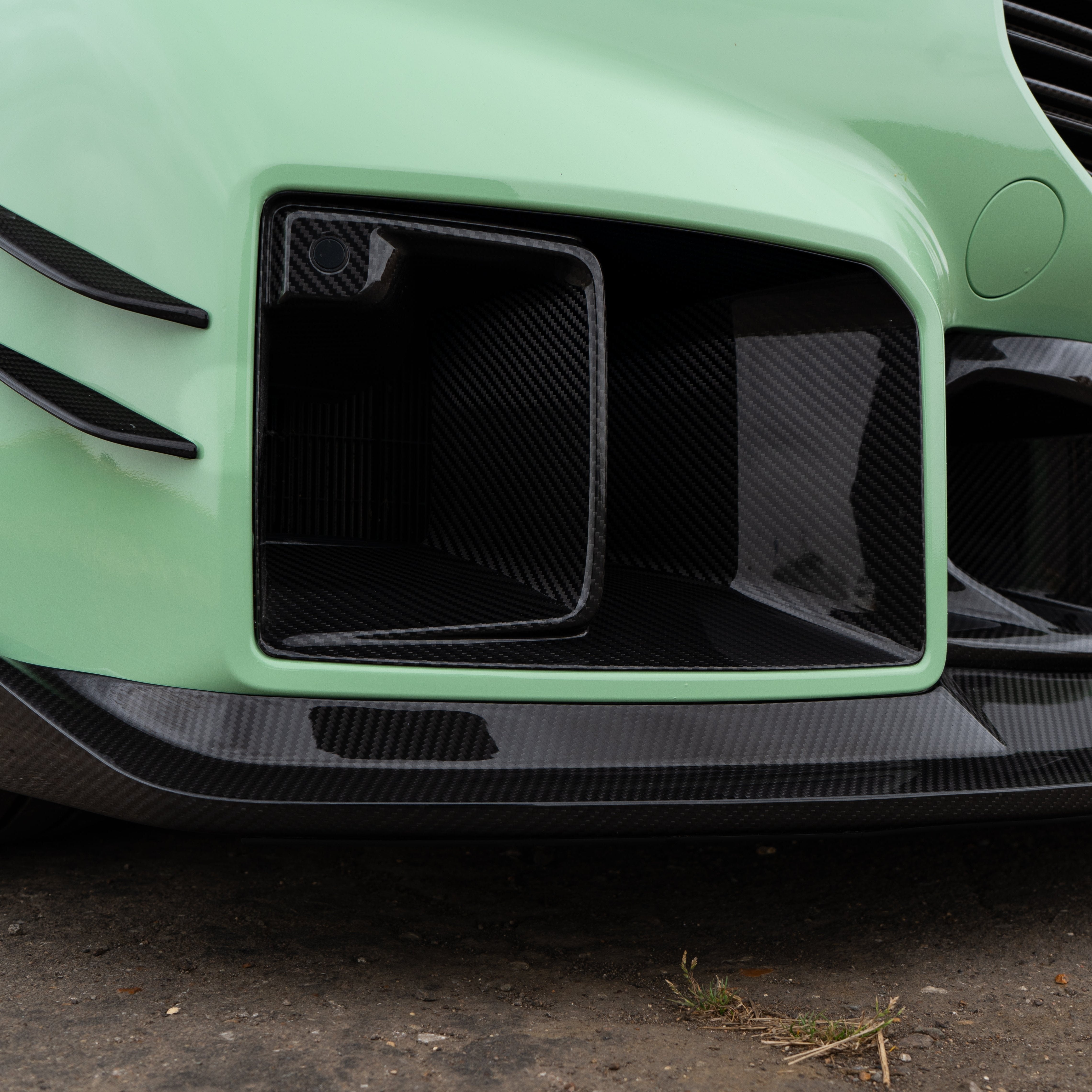 BMW G87 M2 carbon fiber ducts by CT Design, lightweight performance car accessories with sleek, textured carbon fiber finish.
