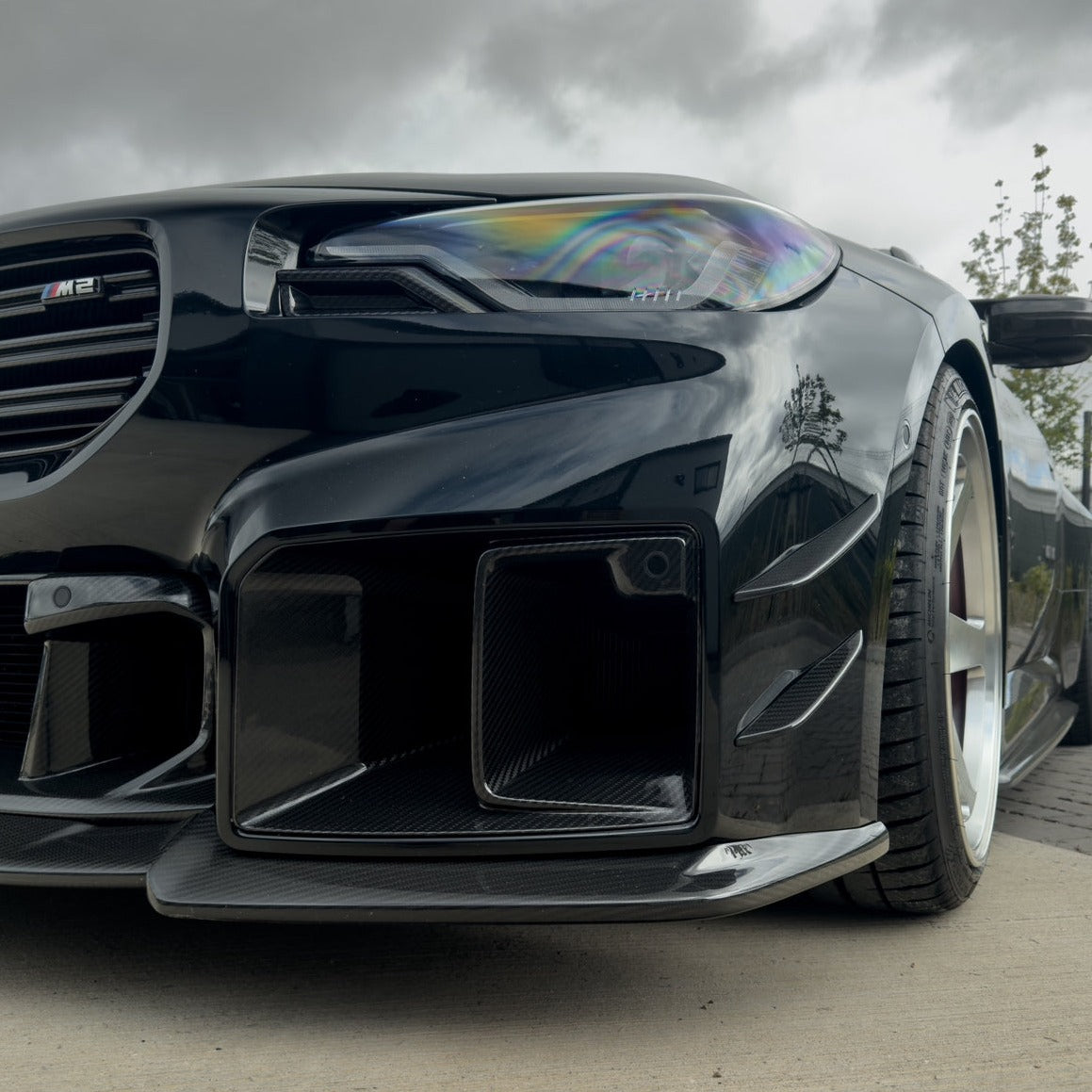BMW G87 M2 carbon fibre ducts by CT Design, V2 accessories, showing sleek, lightweight carbon fibre ducts with detailed textures.