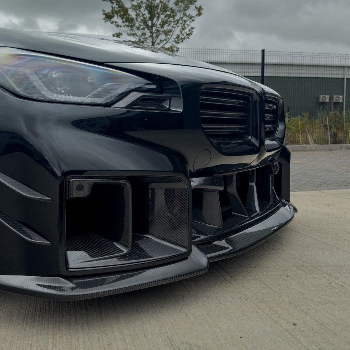 BMW G87 M2 carbon fibre lower grille by CT Design, showcasing sleek, lightweight carbon fibre accessory for enhanced sporty look.
