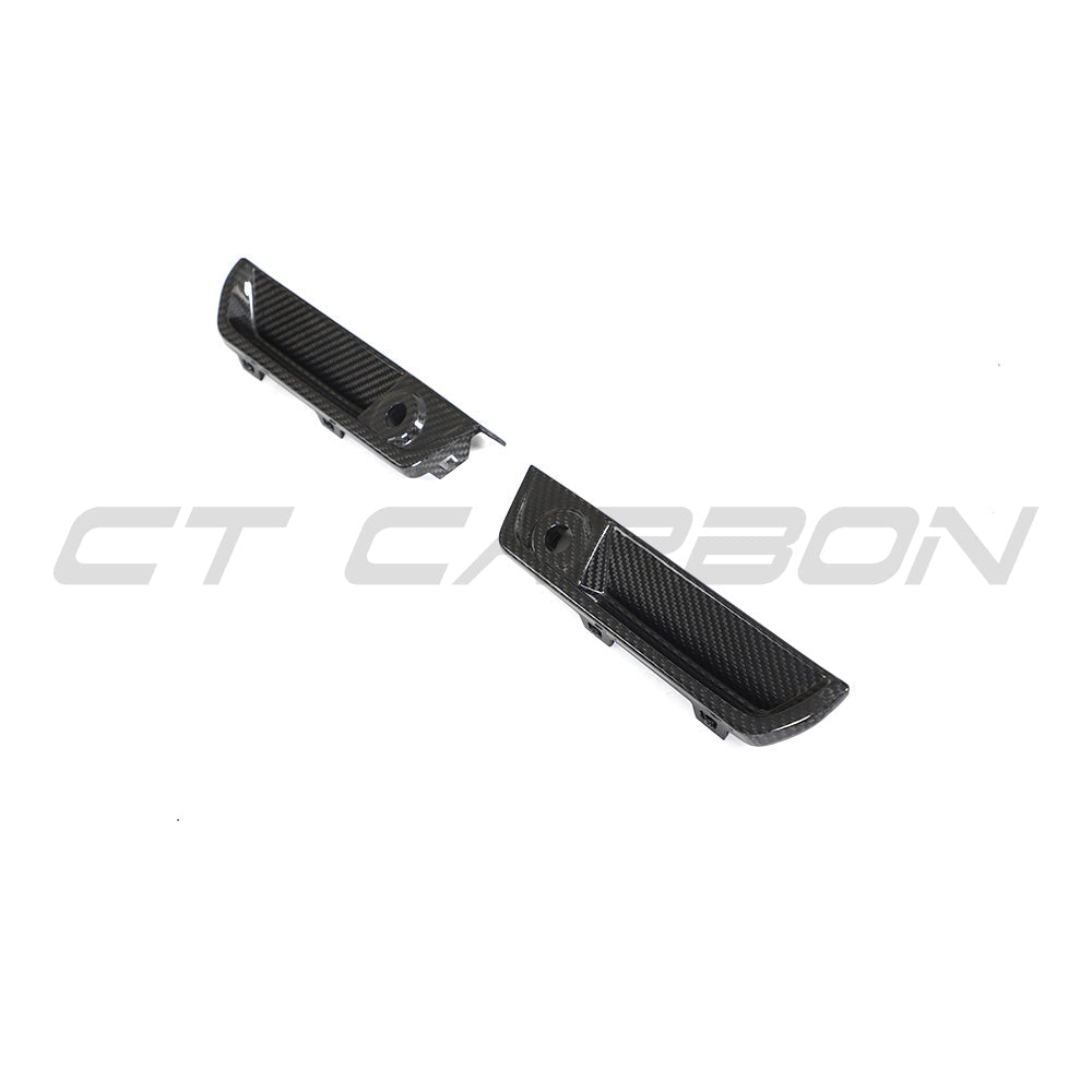 BMW G87 M2 carbon fiber reflector delete accessory by CT Design, showcasing sleek black carbon fiber finish on the car's reflector area.