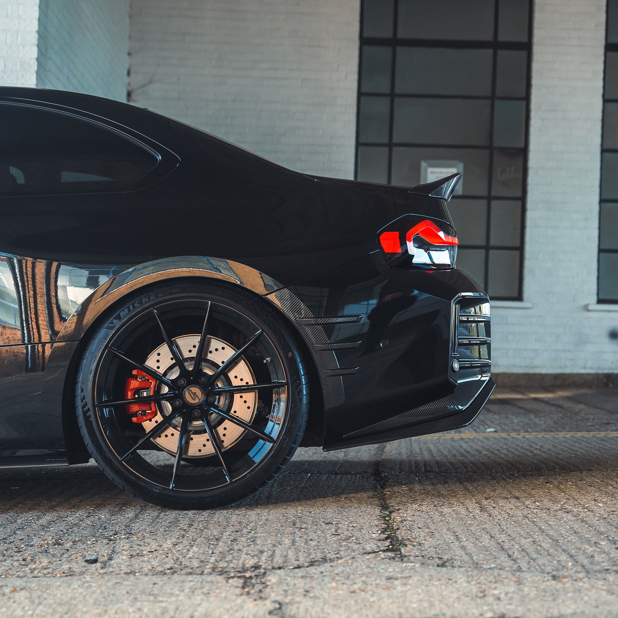BMW G87 M2 full carbon fiber kit by CT Design, showing the lightweight, sleek carbon fiber body components and aerodynamic details.