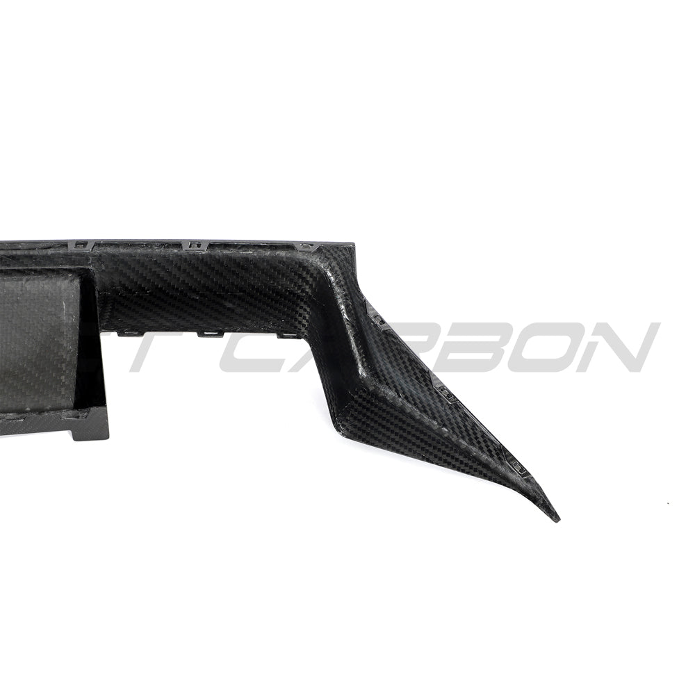 BMW G87 M2 full carbon fiber kit by CT Carbon, including hood, roof, and side panels, displayed on the car.