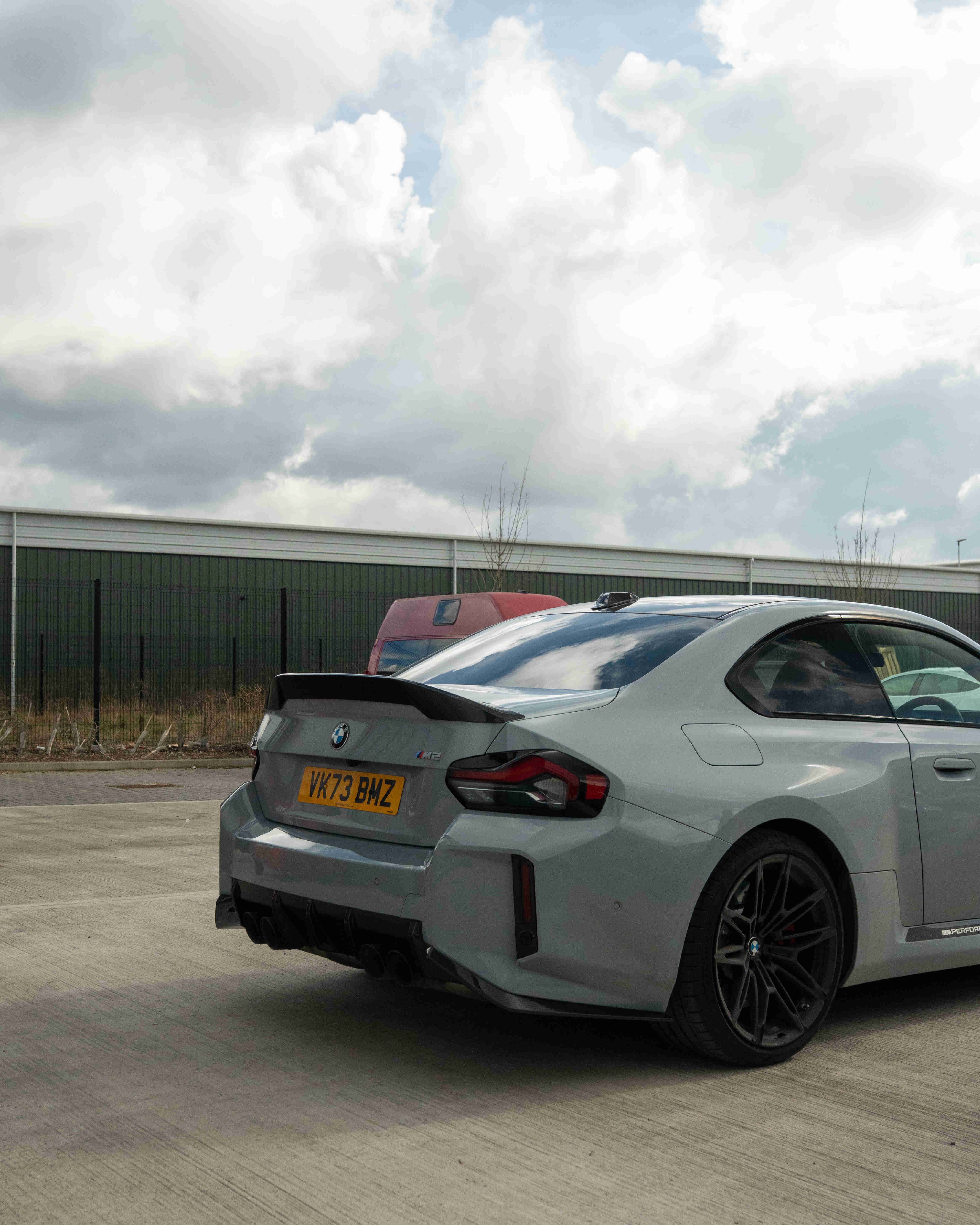 BMW G87 M2 and G42 2 Series carbon fibre spoiler by CT Design, showcasing sleek aerodynamic design on a sports car.