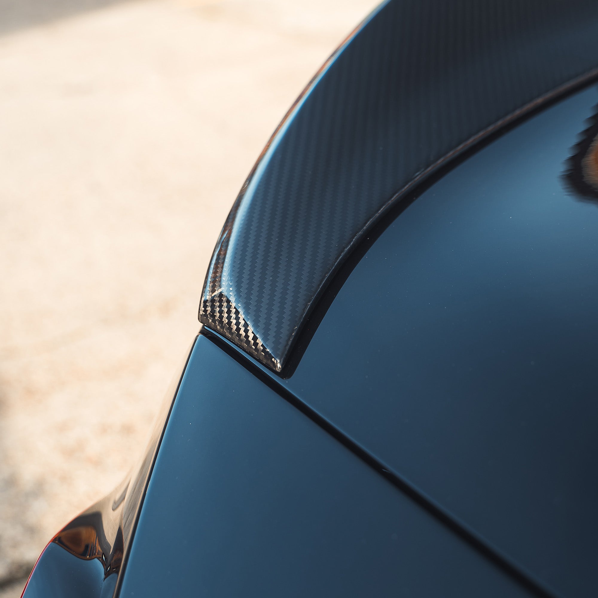 BMW G87 M2 and G42 2 Series carbon fibre spoiler by CT Design, showcasing sleek aerodynamic design and glossy finish.