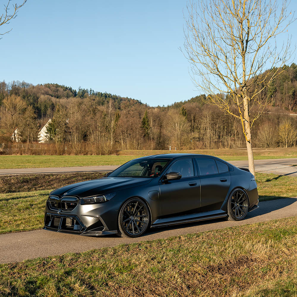 BMW G90 M5 carbon fiber full kit by CT Design, showing the sleek, lightweight carbon fiber components on the vehicle.