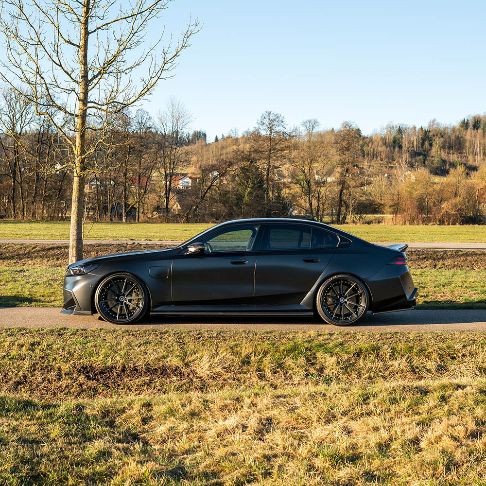BMW G90 M5 carbon fiber full kit by CT Design, detailed view of lightweight, high-performance carbon fiber exterior components.