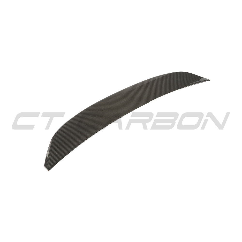 BMW G60 5 Series full carbon fibre kit by CT Carbon, featuring a sleek carbon fibre spoiler on a 2023 model car.