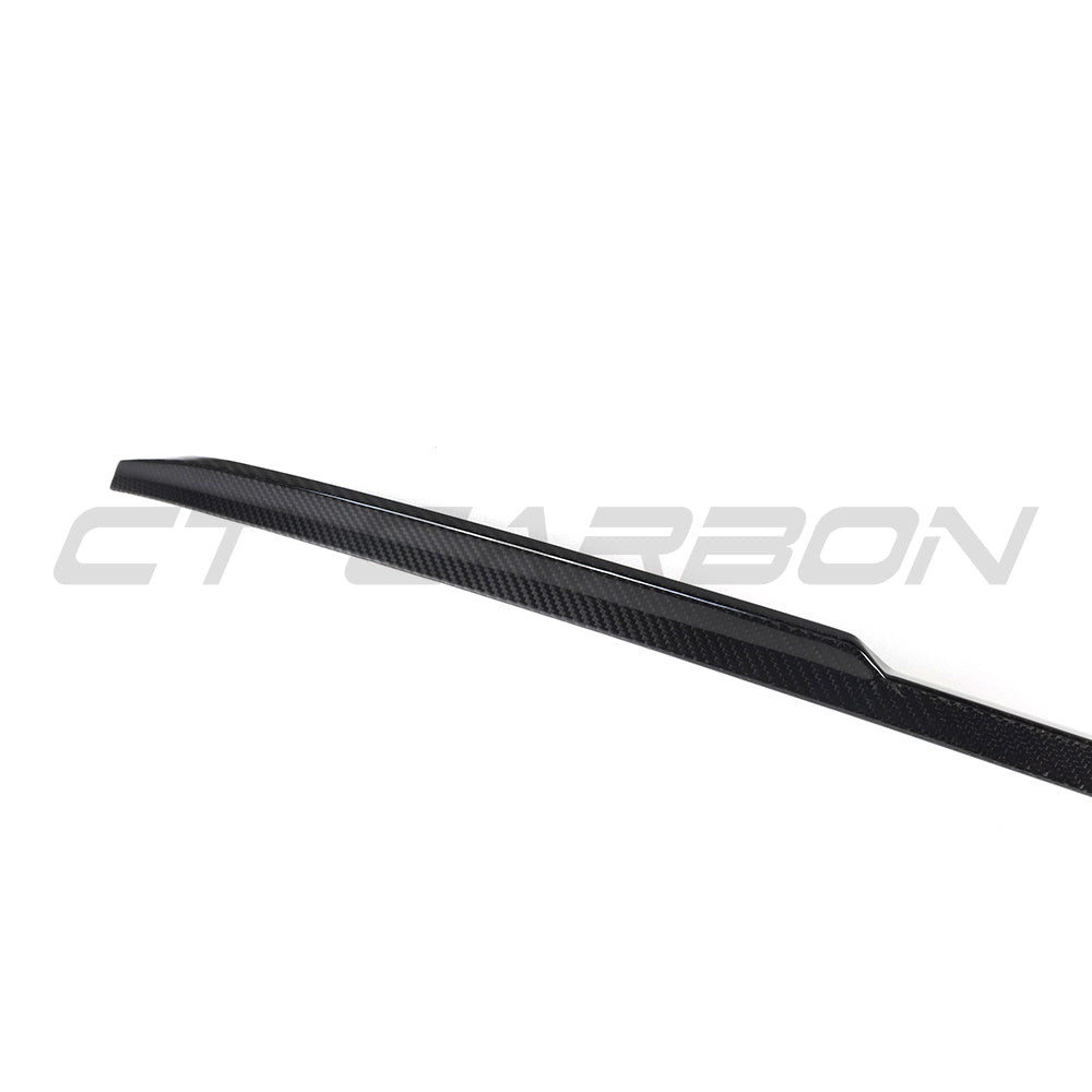 BMW G90 M5 and G60 5 Series 2023 carbon fibre spoiler by CT Carbon, showcasing the sleek, aerodynamic design on a sports sedan.