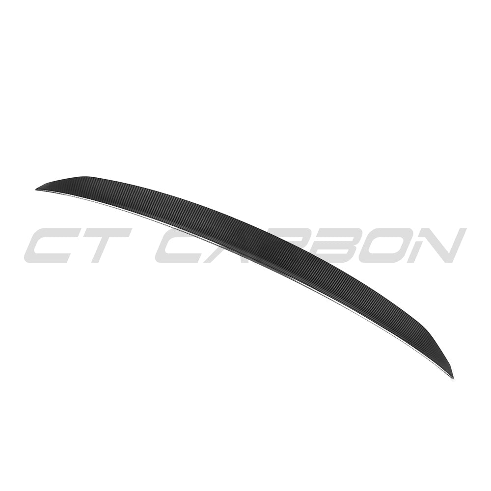 BMW G60 5 Series full carbon fibre kit by CT Carbon, showcasing the sleek carbon fibre spoiler on a black BMW G90 M5.