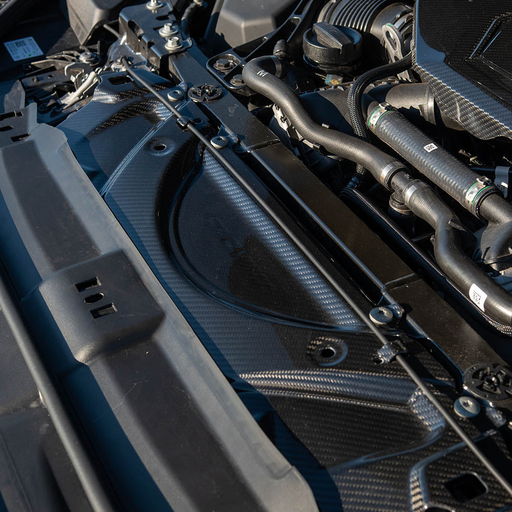 BMW G90 G99 M5 2024 carbon fiber slam panel accessory by CT Carbon, showing the sleek, lightweight black carbon fiber surface.