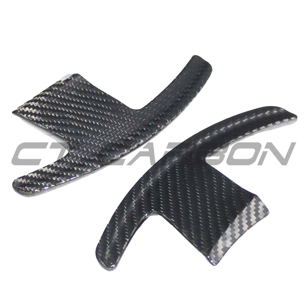 BMW GXX/F40 carbon fiber shifter paddles by CT Carbon, showing sleek black textured finish and ergonomic design for sporty driving.