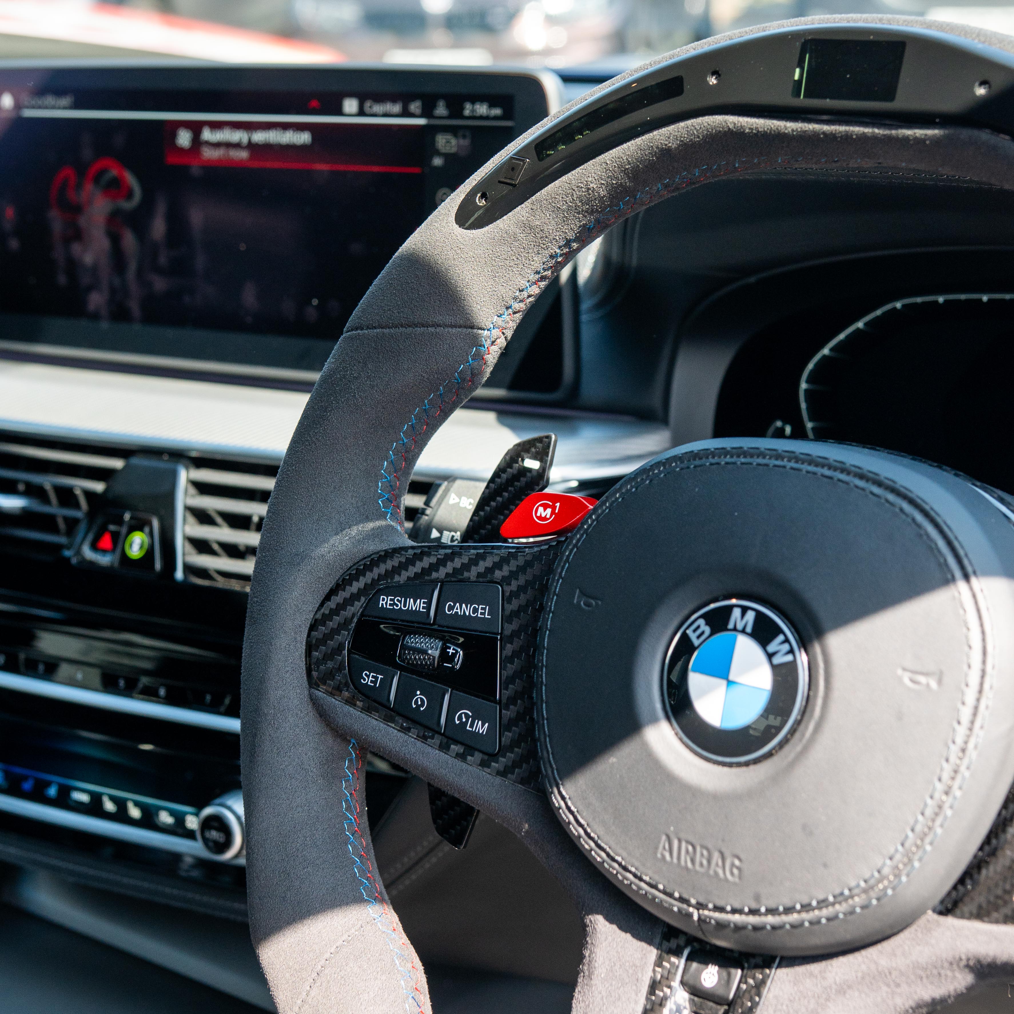 BMW Gxx carbon fiber magnetic shifter paddles by CT Carbon, showing sleek black finish and ergonomic design for sporty driving.