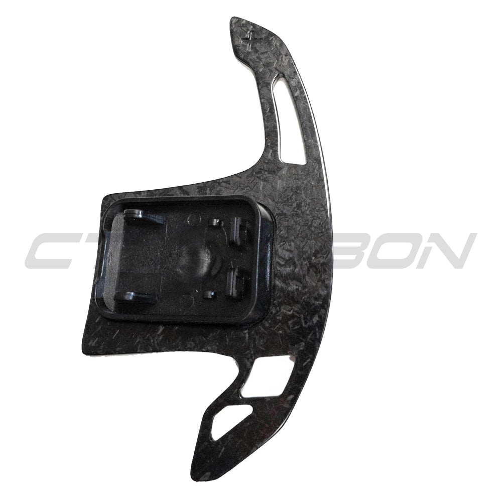 BMW Gxx forged carbon fibre shifter paddles by CT Carbon, close-up view highlighting sleek, lightweight racing-inspired accessories.
