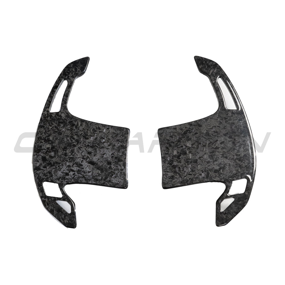 BMW Gxx forged carbon fiber shifter paddles by CT Carbon, sleek automotive accessories for enhanced driving style.