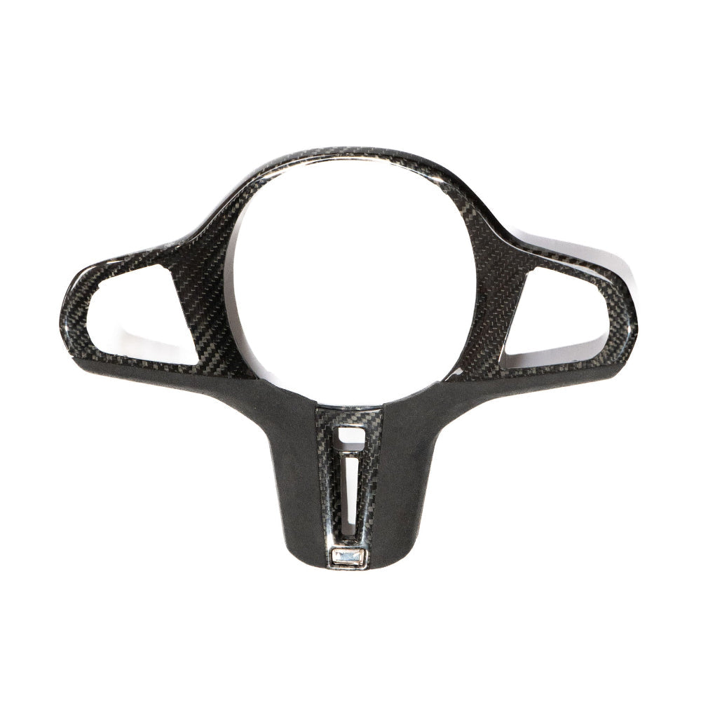 BMW Gxx M carbon fiber steering wheel trim with heating and accessories by CT Carbon, showcasing sleek, textured carbon fiber finish.