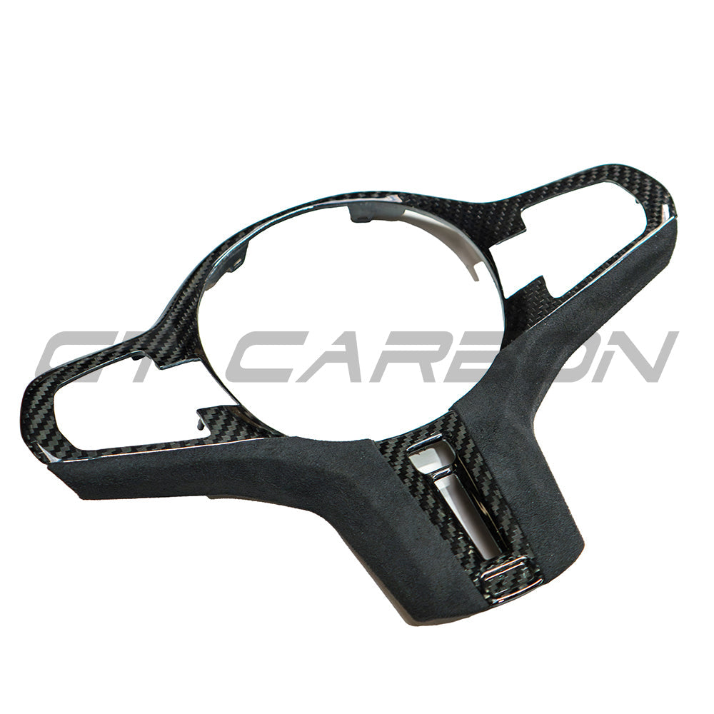 BMW Gxx M carbon fibre steering wheel trim accessory by CT Carbon, featuring heating for pre-LCI models, shown in the image.