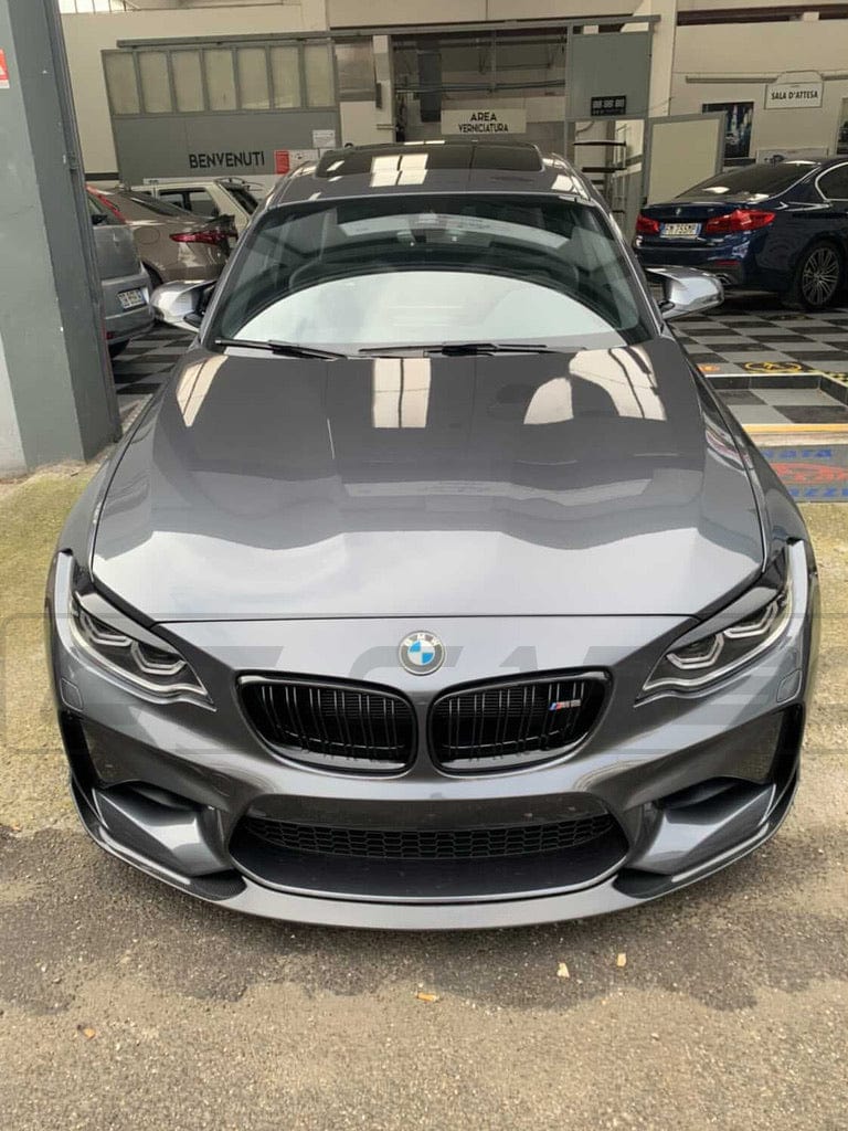 BMW M2 F87 N55 CT Carbon OG carbon fiber splitter attached to front bumper, showcasing sleek, lightweight automotive aerodynamic upgrade.