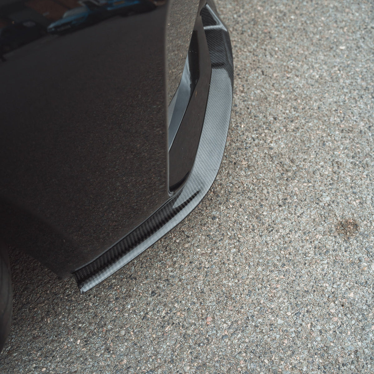 BMW M2 F87 N55 carbon fibre splitter V2 by CT Carbon, featuring a sleek front splitter with a carbon fibre finish and aerodynamic design.