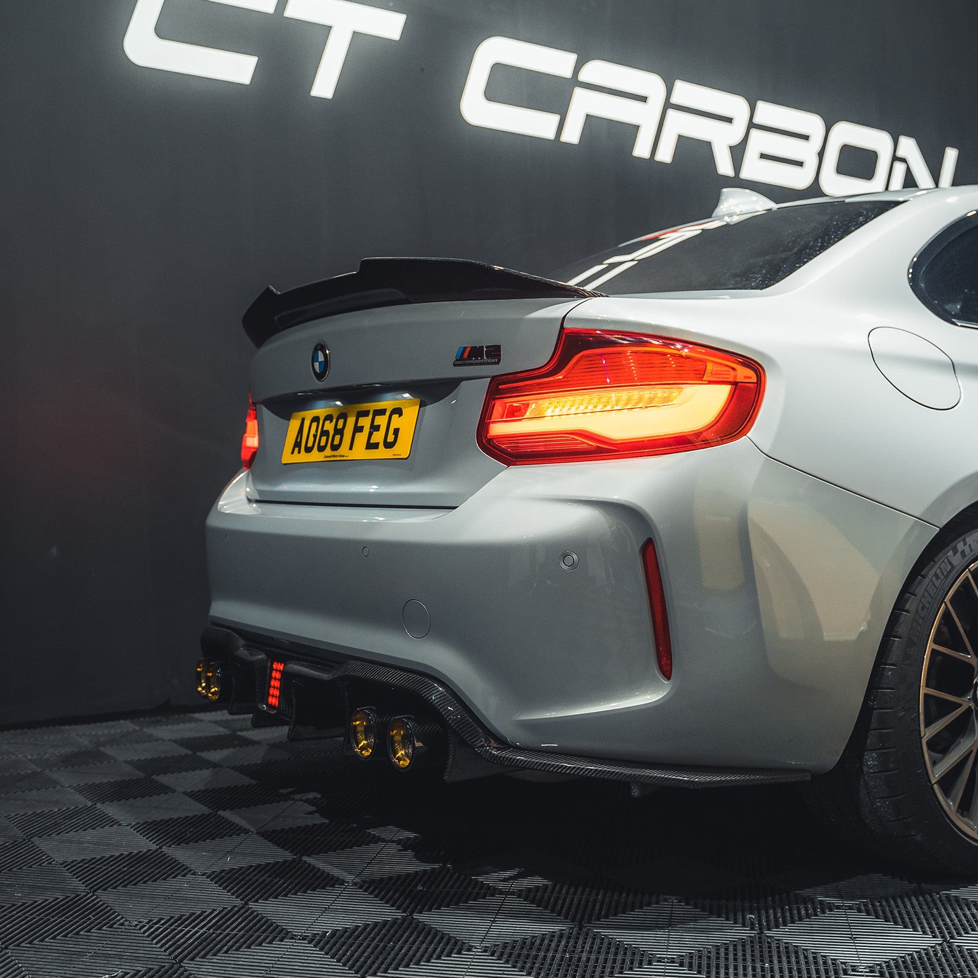 BMW M2 F87 M2C F22 carbon fibre ducktail spoiler by CT Carbon, showcasing the aerodynamic design and sleek finish.