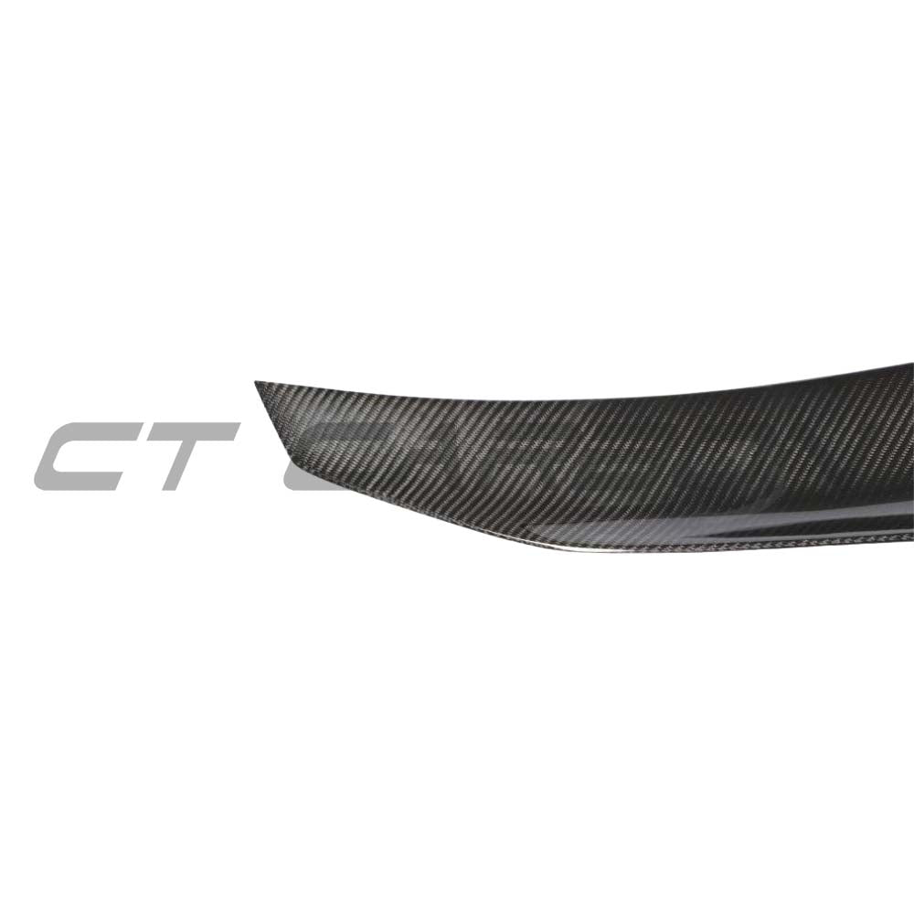 BMW M2 F87 and F22 carbon fibre ducktail spoiler by CT Carbon, showcasing the sleek, aerodynamic design on a sporty vehicle.