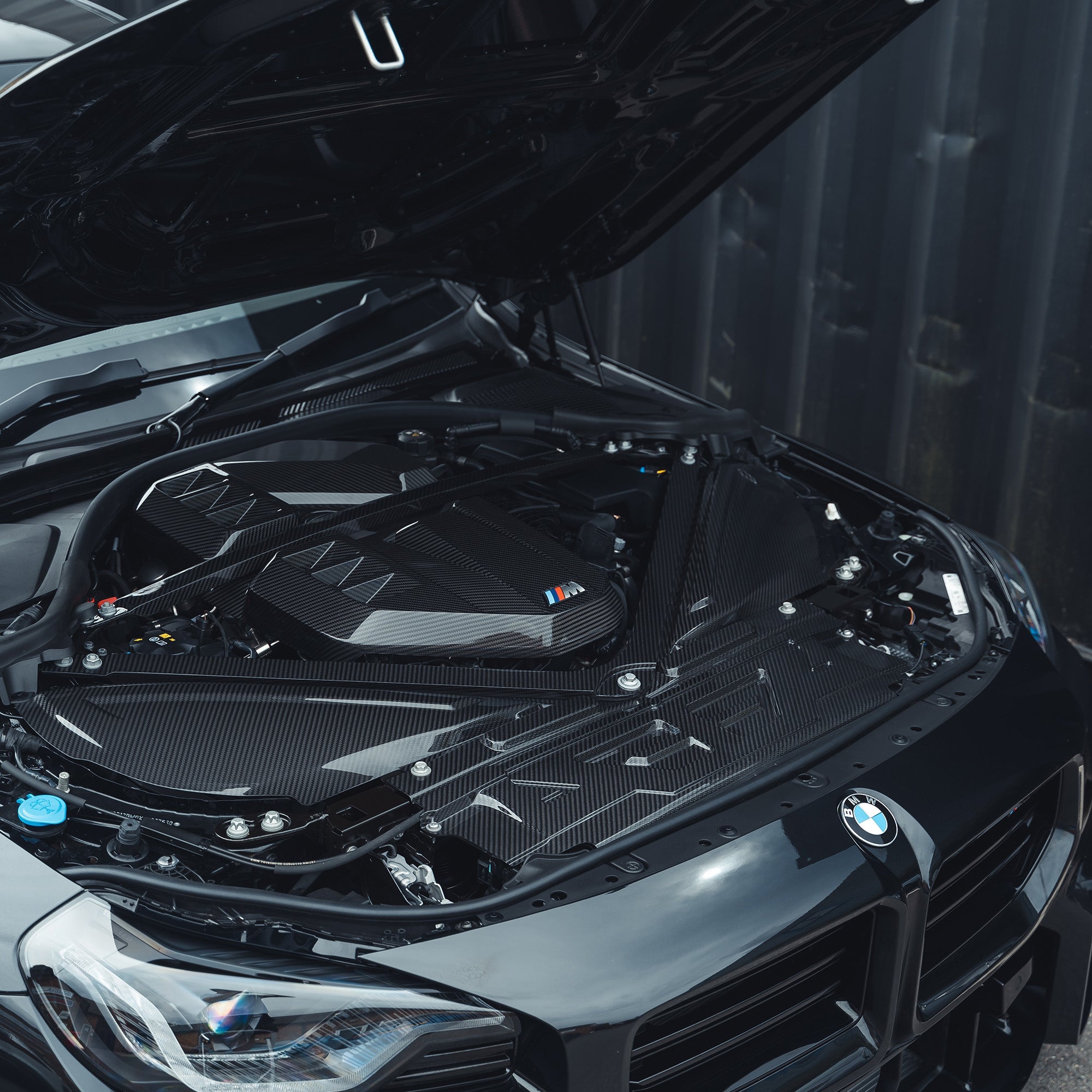 BMW M2, M3, M4 G87, G80, G81, G82, G83 Carbon Fibre Engine Cover by CT Carbon, showcasing sleek black carbon fiber texture.