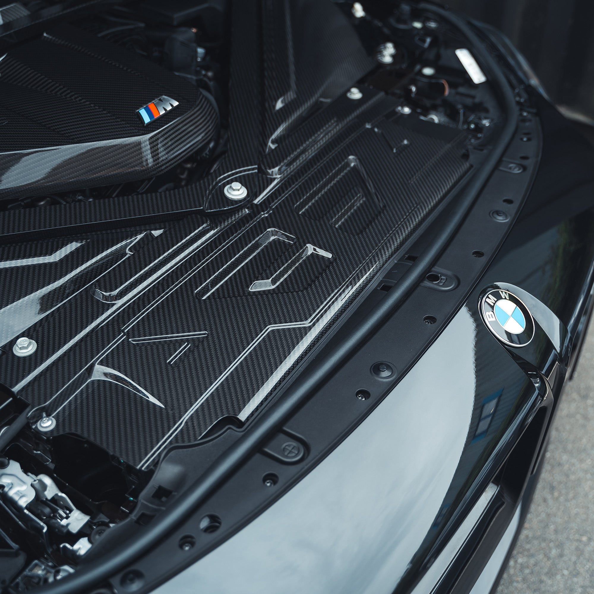 BMW M2, M3, M4 G87/G80/G81/G82/G83 carbon fiber engine dress-up kit by CT Carbon, featuring sleek, lightweight engine accessories.