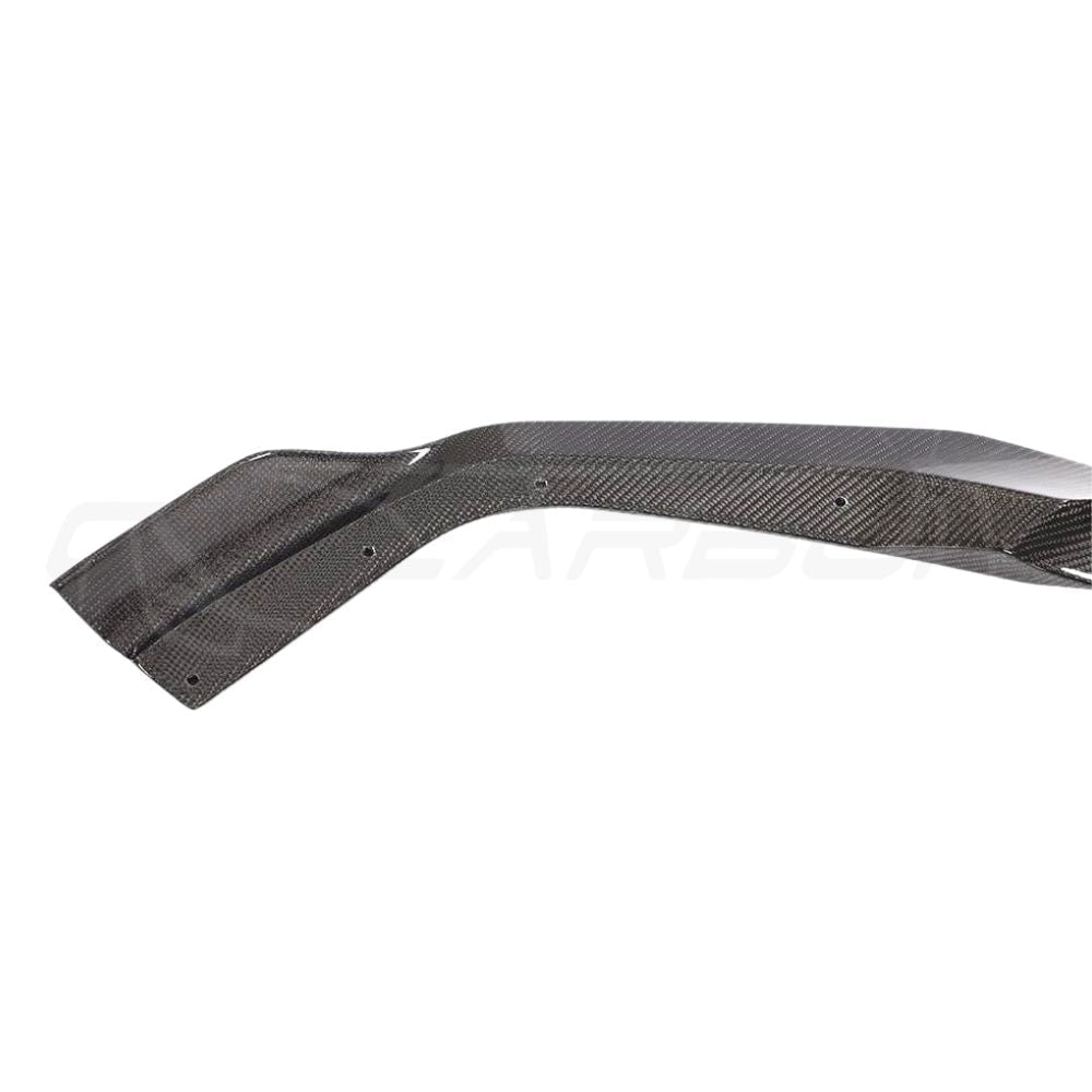BMW M2C F87 carbon fiber splitter by CT Carbon, V4 CS style, showing the aerodynamic front splitter with textured carbon fiber surface.