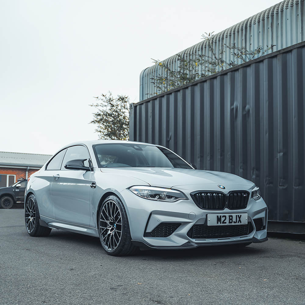 BMW M2C F87 carbon fibre splitter by CT Carbon, featuring a V4 design with CS-style aerodynamic enhancements.